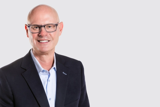 smiling person in professional attire